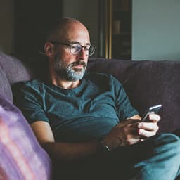 Father reading a message calmly